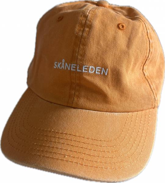 Gelbe Baumwollm&uuml;tze im Vintage-Stil mit dem Schriftzug Sk&aring;neleden auf der Vorderseite