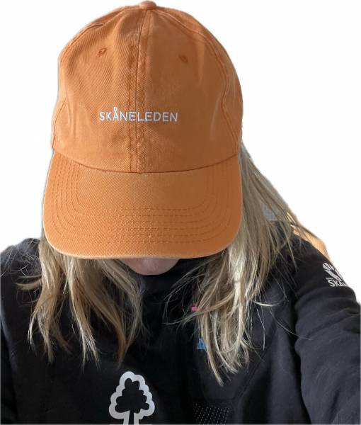 Gelbe Baumwollm&uuml;tze im Vintage-Stil mit dem Schriftzug Sk&aring;neleden auf der Vorderseite